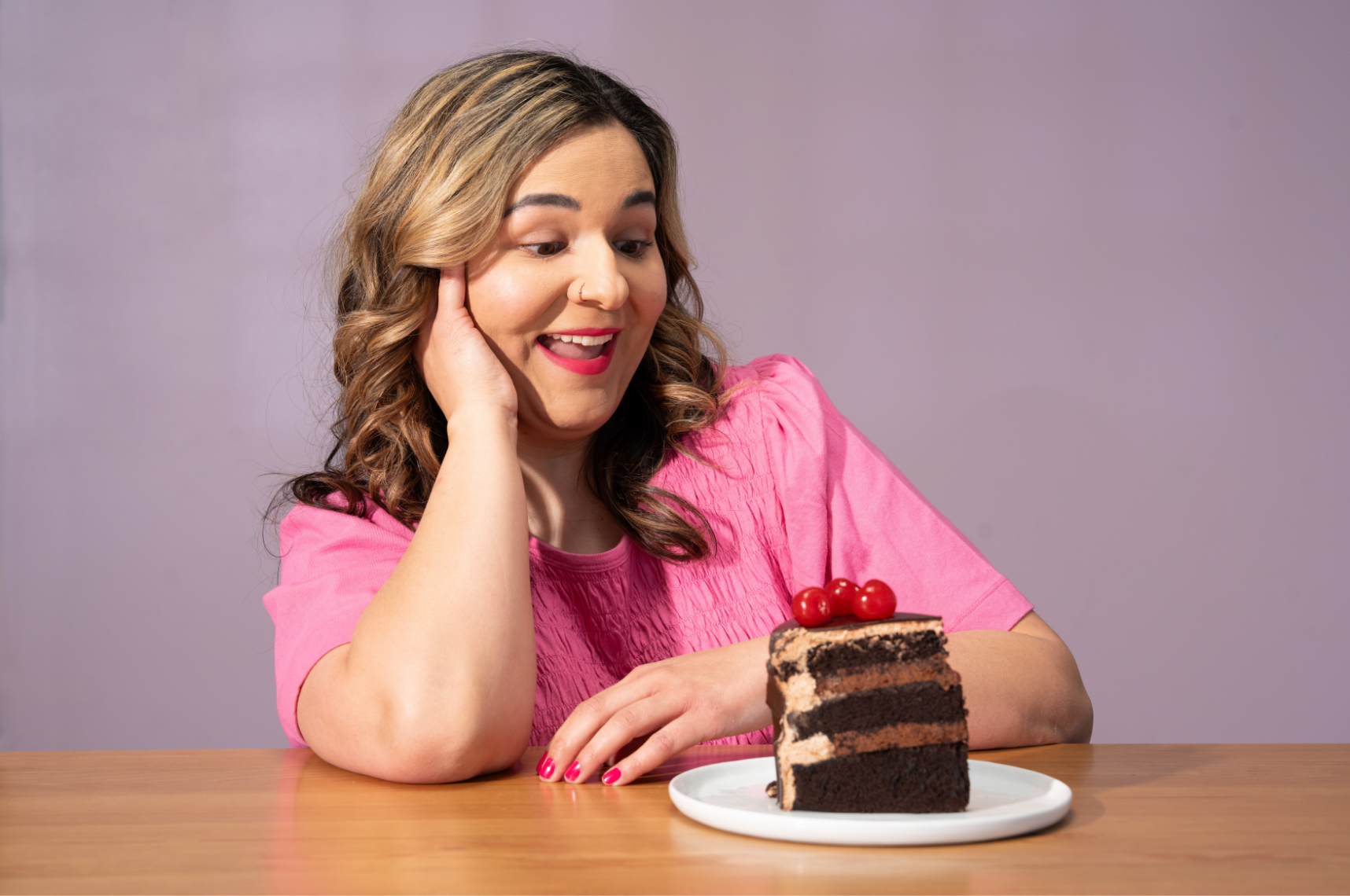 Woman looking at a piece of cake